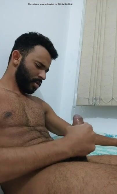 Hairy brazilian jerks off and cums