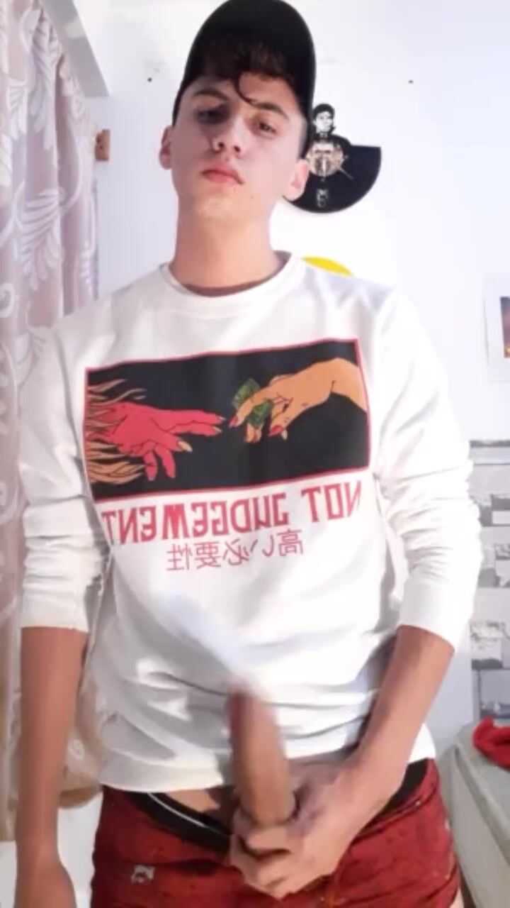 Young men stroke hard cocks