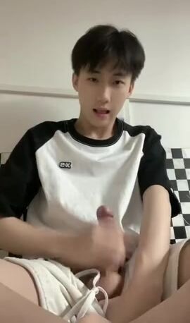 Handsome man strokes cock alone in mirror