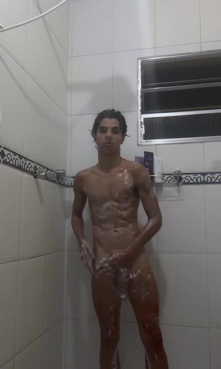 Horny twink strokes big cock in shower