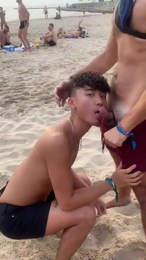Hot twink sucks daddy's cock bareback on beach