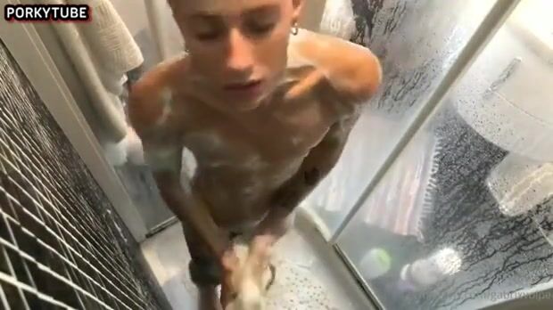 Twink jerks hard cock in shower