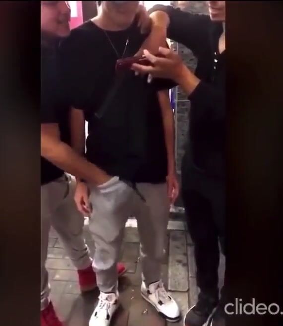 Hung asian stud wanked by friends in public then kicked in the dick