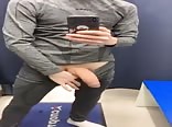 Slim teen jerks his big uncut cock in dressing room