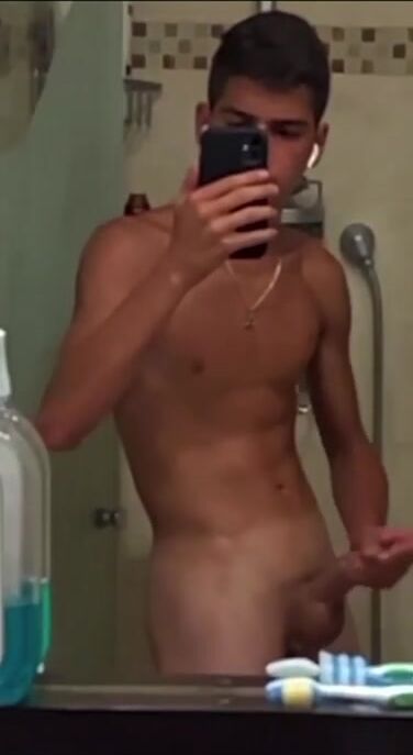 Israeli twink strokes cock in bathroom