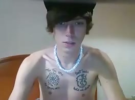 Tattooed smooth twink strokes his fat cock