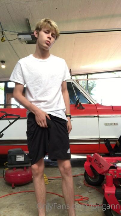 Lad jerks his cock in the garage