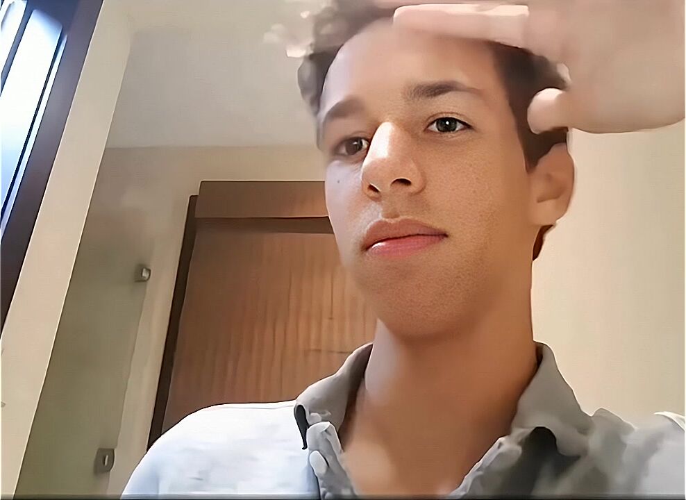 Latino twink strokes long uncut cock