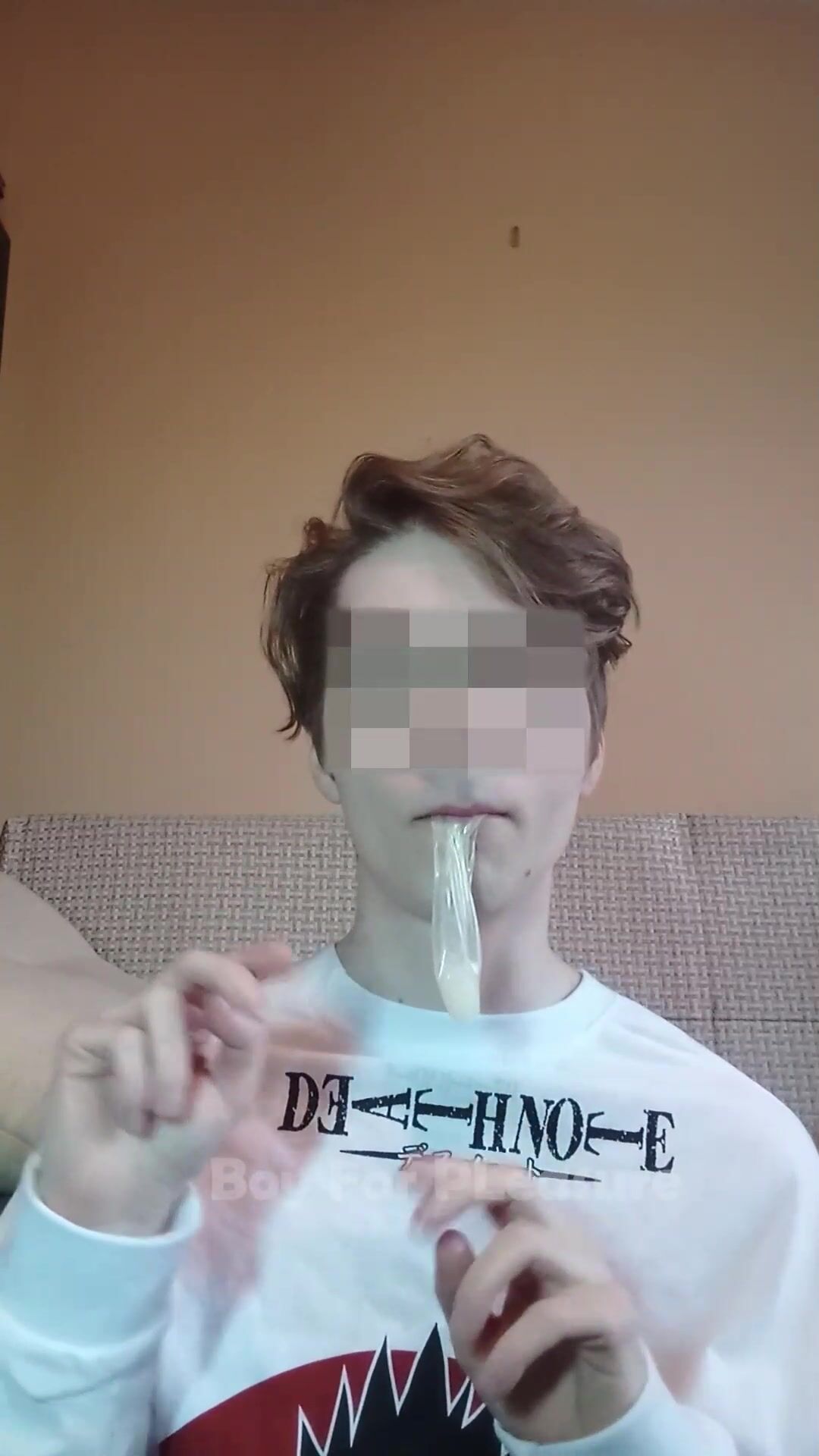 Twink jerks and swallows his load into condom