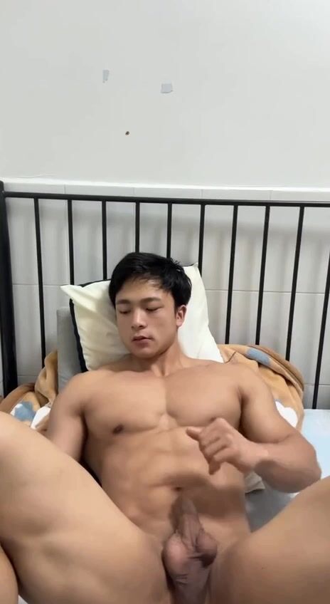 Asian muscle twink jerks his hard cock