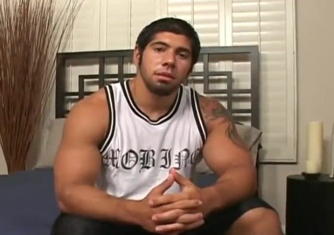 Muscular latino strokes his cock
