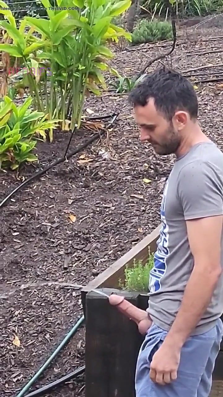 Outdoor twink pisses hard cock