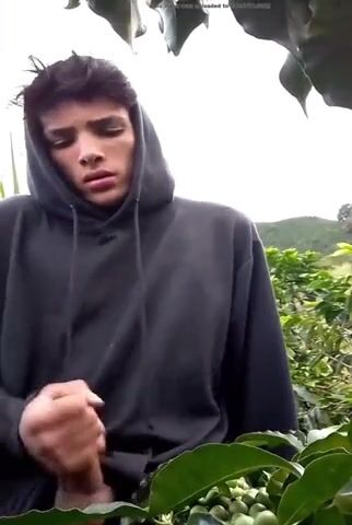 Lad strokes dick outside