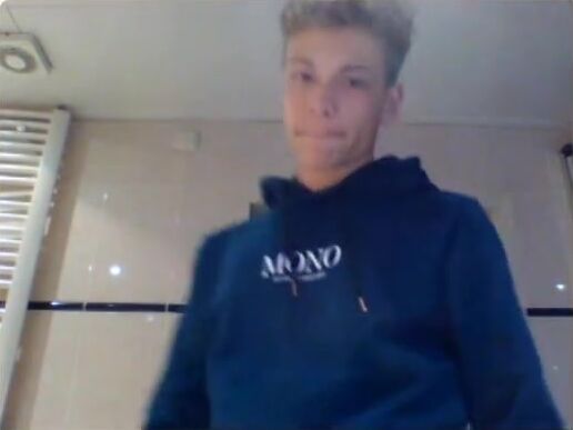 Twink jerks uncut cock in bathroom until he cums