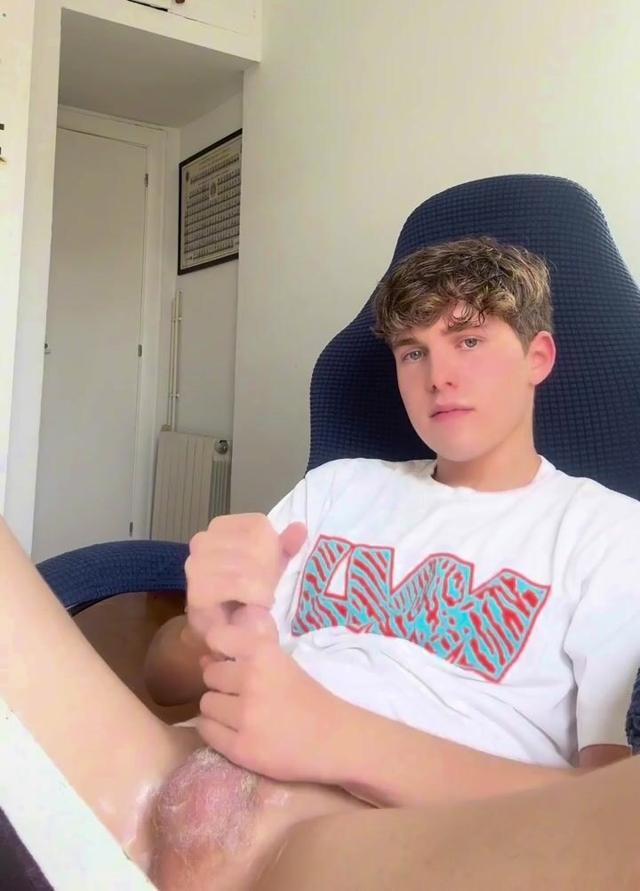 Twink strokes tight foreskin cock on cam