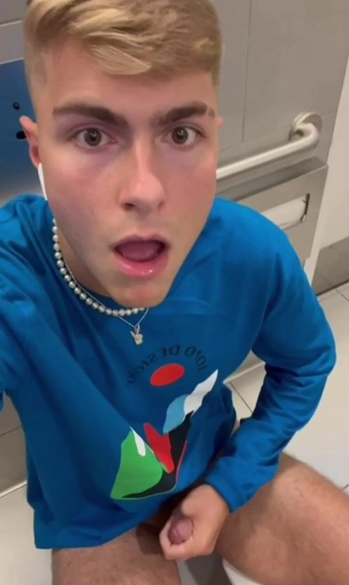 Blond twink cums in public restroom