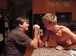 Ripped blond teen armwrestles dad