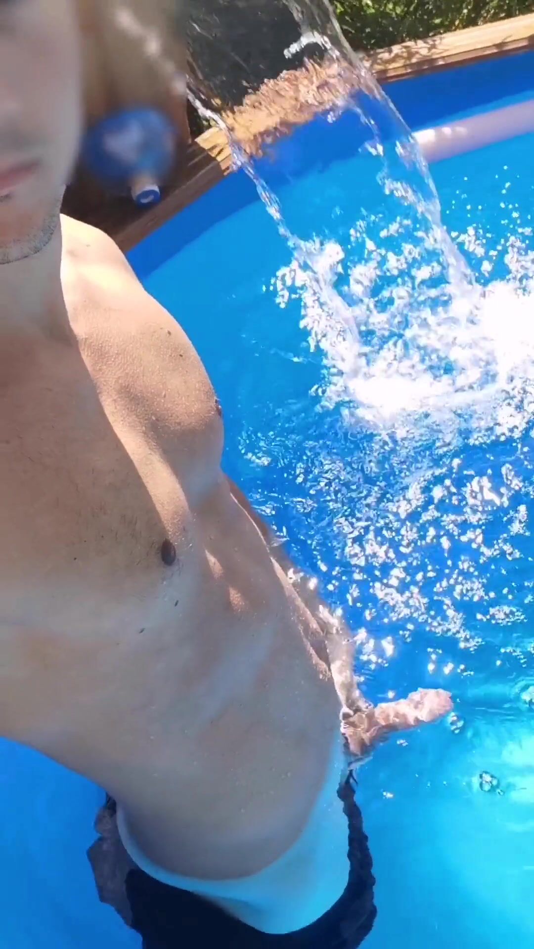 Risky erection flash in pool while neighbors watch outside