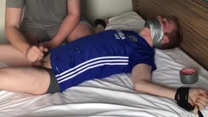 Tied twink on bed gets raw treatment