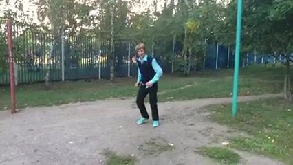 Russian acrobat boy shows off favorite trick