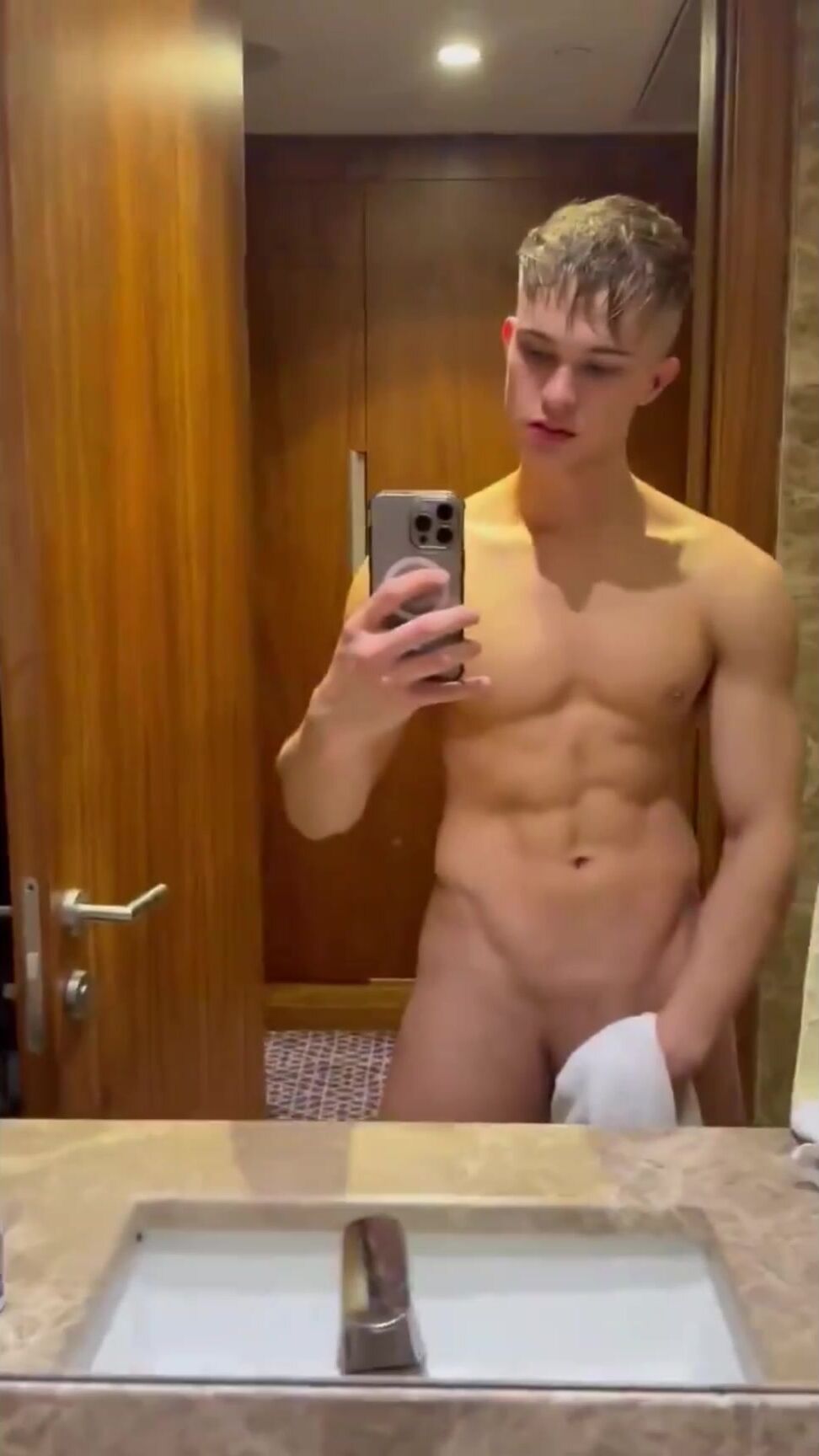 Blond twink admires his hot body