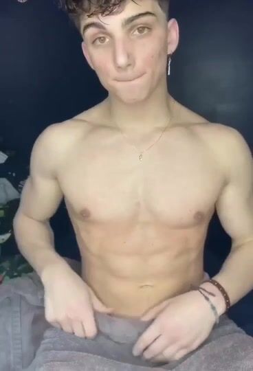 Hot muscle twink jerks his cock and cums hard in solo gay porn
