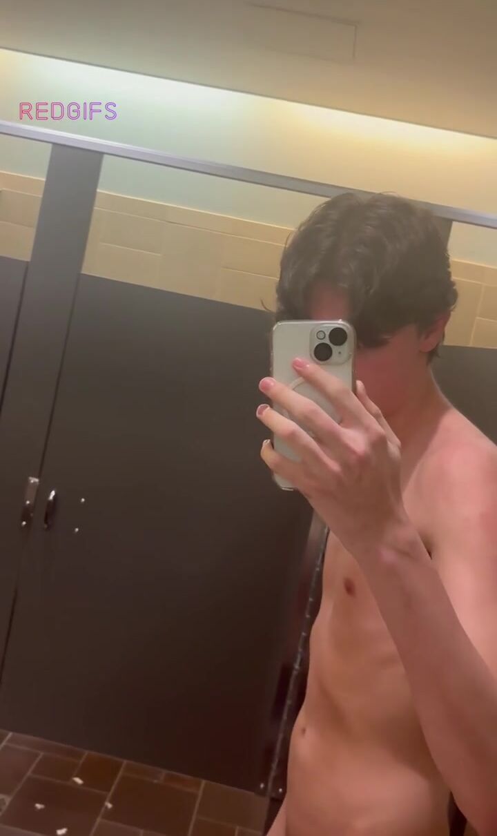 Shaved college twink jerks huge white cock in bathroom