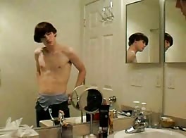 Twink jerks off in shower delight