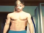 Showing his abs