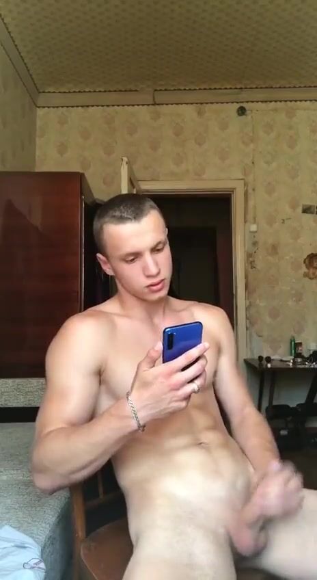 Smooth boy jacks to naughty pics on phone