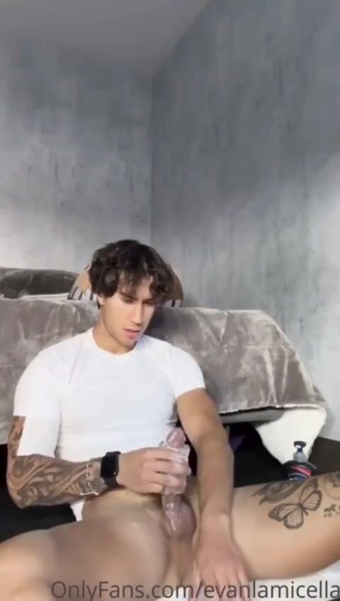 Soccer dude evan jacks his cock with massive thighs