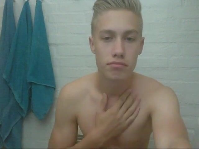 Cute blonde guy wanks and cums in bathroom