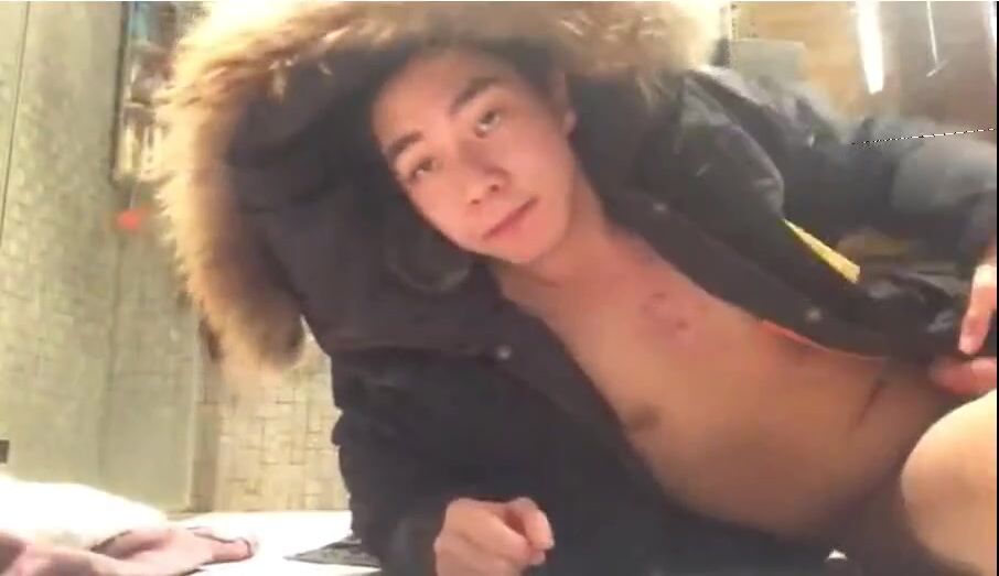 Asian boy jerks sweet cock in bathroom jacket