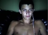 Tanned twink jerks his hard cock