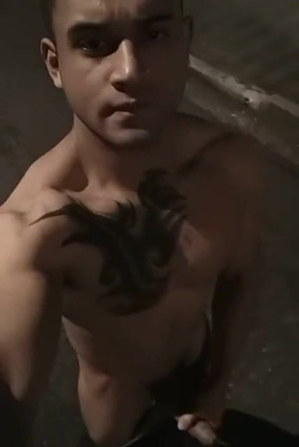 Tattooed latino muscle stud wanks cock on street