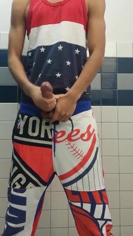Teen ball fan jerks and cums public restroom