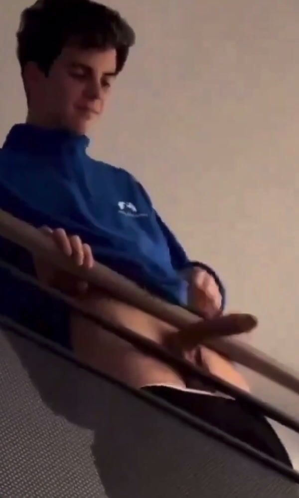 Teen boy strokes hard cock on stairs