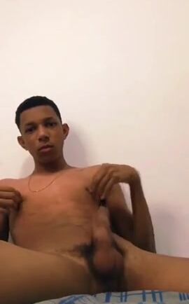 Latin teen strokes his cock