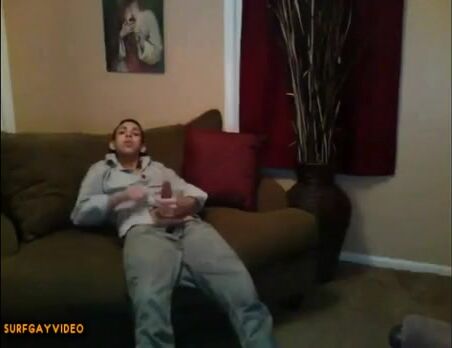 Latino teen jerks off and cums on couch