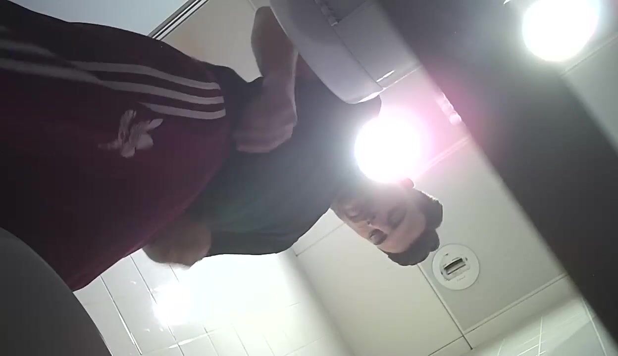 Toilet twink jerks his cock