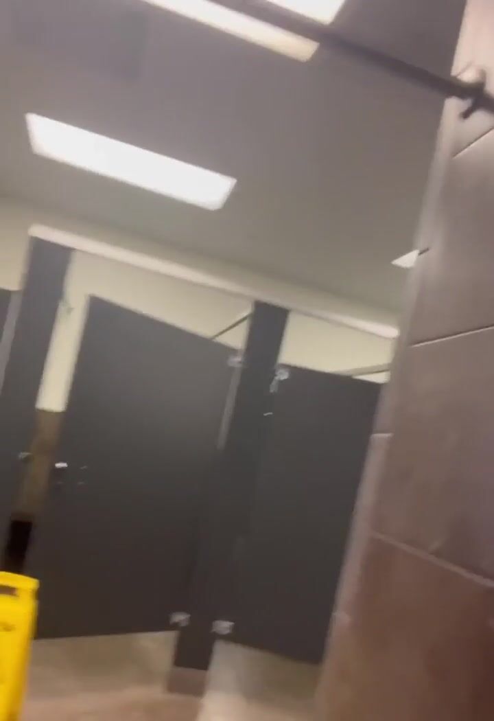 Twink jerks cock in public showers