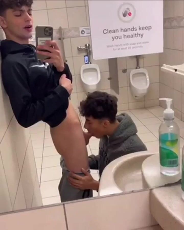 Twink twin brothers share public bathroom cock