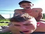 Twinks fucking bareback on a field gay porn