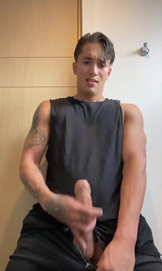 Tattooed uncut asian hunk jerks his cock and cums hard