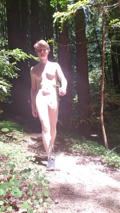Uncut naturist walks forest bare