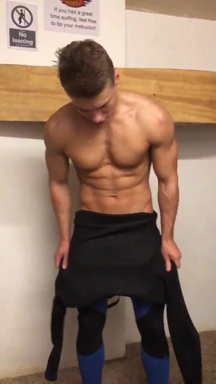 Uncut twink strips out of wetsuit