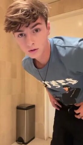 Cute boy strokes his big uncut cock
