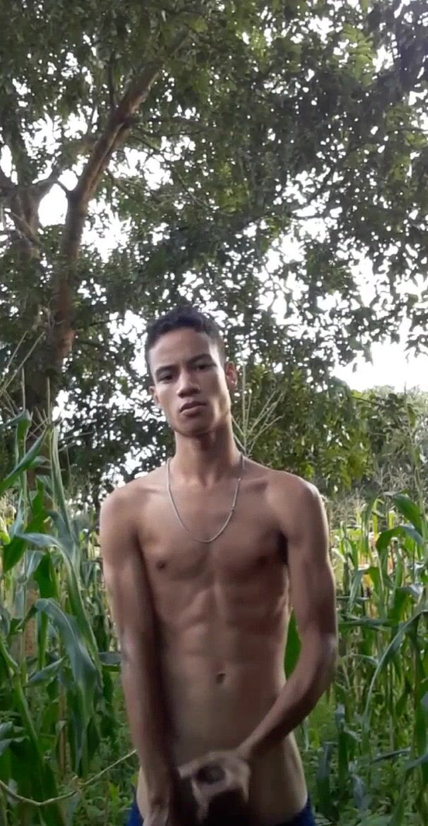 Twink wanks his hard cock in the field