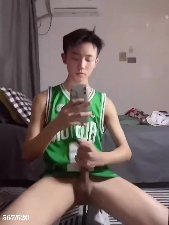 Young asian boy strokes his cock and cums