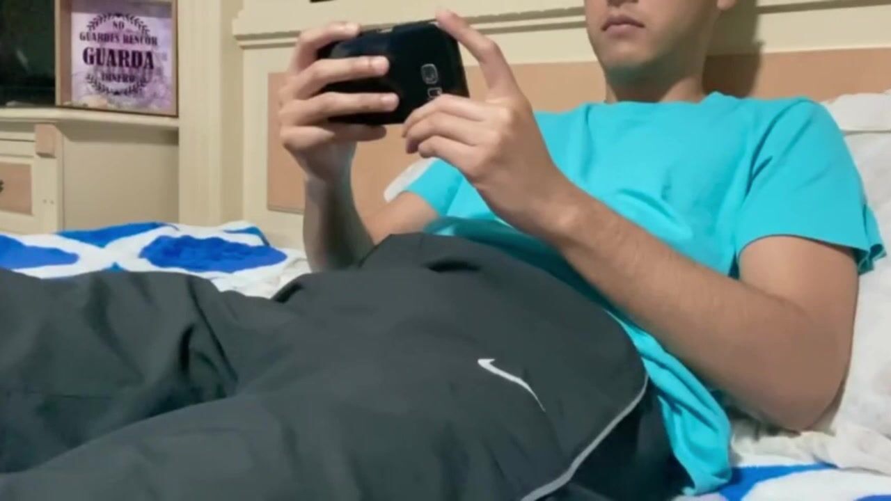 Young skinny guy cums a big load on his chest after watching porn -...